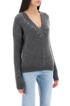 Alessandra Rich sweater crafted in ribbed solid wool blend yarn. Design with V-neck embellished with studs and crystals, it features a regular fit with low-set sleeves. The model is 177 cm tall and wears size IT 40. Composition: 50% WV, 30% WO, 20% PA | Alessandra Rich Women's Wool Knit Sweater With Studs And Crystals in Grey Melange | FW23/24 Wool Knit Sweater, Alessandra Rich, Wool Knit, Wool Blend Sweater, Grey Women, Yoga Wear, Stylish Women, Clothes For Sale, Knit Sweater