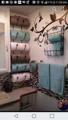 a bathroom with towels hanging on the wall