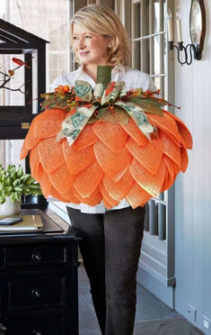 The body of the pumpkin is constructed with poly burlap mesh in orange. The pumpkin stem is olive green poly burlap mesh. Berry accents and a lovely bow adorned with pumpkins complete the look. Pumpkin Door Hanger, Pumpkin Stem, Nostalgic Gifts, Pumpkin Door, Door Entryway, Fall Halloween Crafts, Pumpkin Wreath