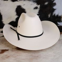 Let your little buckaroo play the part in this one size fits most hat that features a cattleman crown, black string hat band, and venting eyelets. One Size Fits Most (50 -53 CM) 3.75" brim Stretchy Elastic Band inside Cattleman Crown Crown Black, Straw Cowboy Hat, Hat Band, Cowboy Hat, Hat Sizes, Elastic Band, Cowboy Hats, Straw, Cowboy