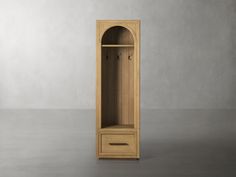 a tall wooden cabinet sitting on top of a floor