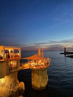 an outdoor restaurant on the edge of a cliff