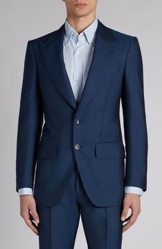 The label's impeccable tailoring shines through on this suit cut from a wool-mohair blend with an iridescent sheen and finished with mother-of-pearl buttons. Jacket has peaked lapels; five-button cuffs; chest welt pocket; front flap pockets; ticket pocket; back vent Pants have zip fly with hook-and-bar closure; adjustable waist tabs; front slant pockets; back button-welt pockets Jacket is lined 70% wool, 30% mohair Dry clean Made in Italy Designer Clothing Designer Silk Suit With Lapel Collar, Designer Silk Suits For Business, Luxury Wool Suit For Evening, Luxury Wool Evening Suit, Luxury Silk Suits With Lapel Collar, Designer Suits With Welt Pockets For Semi-formal Occasions, Luxury Silk Suits For Semi-formal Occasions, Luxury Wool Three-piece Suit For Wedding, Designer Single Breasted Wool Suit