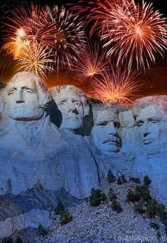 fireworks light up the night sky over mount rusher and abraham lincoln's head