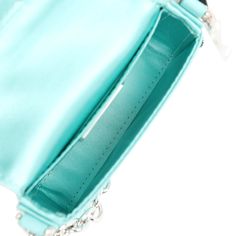 This Fendi x Tiffany Nano Baguette Charm is in tiffany blue silk and leather with sterling silver hardware, front flap snap closure, and Tiffany sterling silver charm.The interior is lined in tiffany blue fabric with one slip pocket.Origin: ItalyCondition: New and never worn Accompanied by: Fendi box, dustbag, carebook and retail UPCMeasurements: 4.5" width x 2.5" height x .5" depth; 3" strap Fendi Tiffany Baguette, Light Blue Bags With Silver-tone Hardware For Everyday Use, Light Blue Bags With Silver-tone Hardware, Silver Fendi Bag, Luxury Blue Shoulder Bag With Silver-tone Hardware, Baguette Bag, Bag Light, Prada Crossbody Bag, Carry All Bag