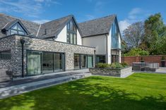 a large house that has grass in front of it