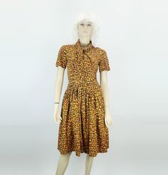 A very pretty dress from the 1950s to 60s. Fitted at the top, button placket and shawl collar. Wide skirt. Zipper on the left side seam. Not lined. Basic color brown, abstract pattern in yellow, orange and ochre. No material information, probably hand-sewn unique piece. In my opinion it would have to be cotton, it can definitely be ironed at the highest setting.  Very good condition.  No size information, estimated to correspond to today's size 36 or S. Please note: All size information is estim Wide Skirt, Skirt Zipper, Jaune Orange, Yellow Abstract, Pretty Dress, Brown Orange, Basic Colors, Vintage Dress, Dress Clothes For Women