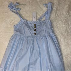 Like New, Just No Tags Urban Outfitters Uo Light Blue Dress: Babydoll, Buttons, Tie Size Small, But Since Adjustable Tie Straps, Could Fit A Medium Or Extra Small Too! Lightweight Fabric, Perfect For The Summer Blue Cotton Mini Dress With Tie Straps, Blue Cotton Dress With Tie Straps, Blue Cotton Dresses With Tie Straps, Blue Dresses With Tie Straps For Casual Wear, Blue Sundress With Tie Straps For Daywear, Blue Cotton Dress From Urban Outfitters, Blue Cotton Dresses By Urban Outfitters, Urban Outfitters Blue Cotton Dress, Urban Outfitters Blue Cotton Mini Dress