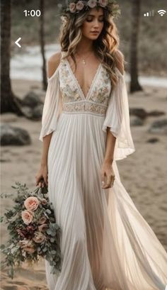 a woman in a white dress holding a bouquet and wearing a flower crown on her head