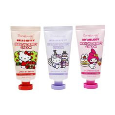 three tubes of hello kitty hand and body lotion next to each other on a white background