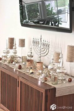 a chandelier sitting on top of a wooden cabinet