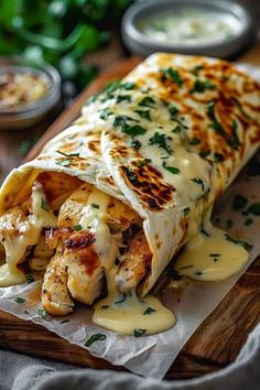 chicken enchilada wrapped in tortilla wrap with melted cheese and herbs