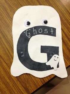 a paper ghost with the letter g on it