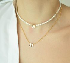 GET UP TO 30% OFF ON SELECTED ITEMS, VISIT OUR SHOP TO SEE MORE AND HAVE FUN! This delicate Pearl Initial Necklace is the most trendy, affordable and high-quality handmade piece you ever have. This personalized letter necklace is a great birthday gift, bridesmaid or mom gift option because it is so personal and dainty that everyone how got it will feel special #namenecklace#customletternecklace#initialnecklace#personalizedjewelry#birthdaygift#mothersday#handmadenecklace#pearlbeadednecklace Personalized Dainty Pearl Necklace, Personalized Pearl Necklaces As Gifts, Pearl Necklace With Letter Beads As Gift, Pearl Necklace With Letter Beads For Gift, Personalized Pearl Necklace As A Gift, Personalized Pearl Necklace As Gift, Personalized Dainty Pearl Necklace As Gift, Personalized Pearl Necklace For Gift, Personalized Pearl Necklace With Initial Pendant As Gift