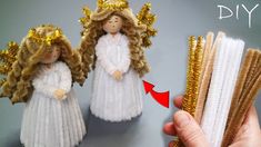 a hand is holding some gold glittered hair and an angel doll with long blonde hair