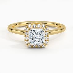 a yellow gold engagement ring with a princess cut diamond surrounded by round brilliant pave diamonds