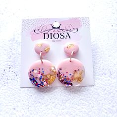 These head-turning pretty pink resin earrings are handmade and unique. A pop of colour and sparkle will add elegance & style to your outfit.  The resin and custom glitter combinations are hand mixed and poured, then cured and sanded to a stunning, shiny finish. Every pair is unique due to the nature of hand-poured resin.  4 cm long Handmade Rose Gold Earrings For Party, Handmade Pink Earrings For Birthday, Pink Round Earrings For Birthday, Trendy Pink Earrings For Gifts, Handmade Pink Earrings For Celebration, Elegant Pink Earrings For Birthday, Glitter Round Earrings For Gifts, Trendy Glitter Gold Earrings, Pink Glitter Jewelry For Birthday