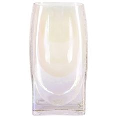 a clear glass vase sitting on top of a white table