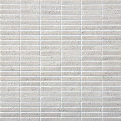 a white brick wall textured with small squares