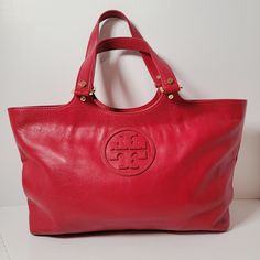 Tory Burch Bombe Red Leather Logo Tote Hand Bag Approx 17" x 9" x 4". Excellent Pre-owned Condition. Shipped with USPS ground advantage. Red Travel Bags With Gold-tone Hardware, Classic Red Shoulder Bag With Leather Handles, Large Red Shoulder Bag For Travel, Large Red Shoulder Bag With Large Capacity, Large Red Everyday Shoulder Bag, Large Red Shoulder Bag For Everyday, Leather Logo, Hand Bag, Red Leather