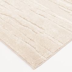 a white rug with lines on it