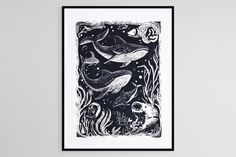 a black and white drawing of two whales in the ocean, with fish swimming around them