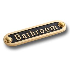 a bathroom sign on a white background with the word'bathroom'in gold and black