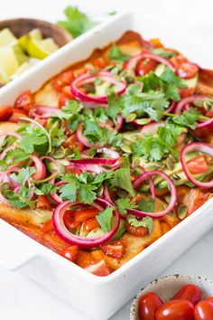 A colorful vegan enchiladas dish topped with avocado, cherry tomatoes, red onion, cilantro, and seeds. Cashew Cream Sauce, Red Enchilada Sauce, Cashew Cream, Pickled Red Onions, Enchilada Sauce, Grape Tomatoes