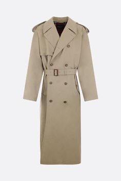 Balenciaga's double-breasted oversized trench coat crafted in beige cotton drill with removable belt. Featuring wide lapel, tabs at shoulders, long sleeves wtih tabs at cuffs, button closure, multiple pockets, back stormshield and box-pleat at hem at back. Lined interior.Gender: MenMaterial: T COTTON 100% ;BU BUBALUS BUBALIS O:IN 100% ;F WOOL 100% ;FM CUPRO 100% ;FP COTTON 100% ;Color: MILITARY BEIGEMade in: ITProduct ID: 776657TKP062801*Import tax/duty will be calculated at checkout (If applica Classic Khaki Belted Outerwear, Classic Khaki Outerwear With Belted Cuffs, Classic Oversized Outerwear With Belted Cuffs, Oversized Trench Coat, Military Coat, Cotton Coat, Box Pleats, Double Breasted, Balenciaga