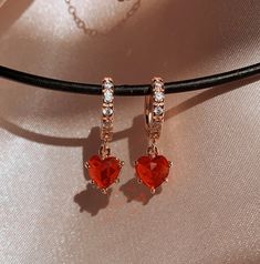 "Ruby Heart Earrings, Necklace, or Set. NEXT DAY SHIPPING * * Dimensions & Material ∙ The chain type is Twist, the chain length is 14\", and it comes with a 2\" extender so you can fine-tune. ∙ Chain types are 18K Gold Plated over Stainless Steel Chain (1.5 microns) - except Figaro (S), which is 18K Gold-Filled over Brass ∙ Pendant is 18K Gold Plated over Brass. ∙ Pendant stone is Cubic Zirconia ∙ Hoop Size: 12 mm ∙ Hoops are Gold-Filled over Brass ∙ Charm Size: 7 x 8.5 mm ∙ The necklace is %100 Heart Huggies, Garnet Heart, Red Heart Earrings, Sugar Land, Red Jewelry, Earrings Red, Red Earrings, Girly Jewelry, Jewelry Inspo