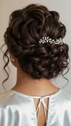 the back of a woman's head wearing a bridal hair comb