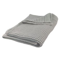 a gray blanket folded on top of each other