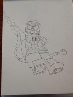 a pencil drawing of a lego character sitting on top of a table