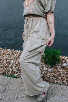 Get ready to slay the day with these Effortless Behavior Khaki Pants! With a stylish drawstring and wide leg cargo design, these pants will keep you looking on-trend while also being ultra-comfortable. The mineral wash adds a unique touch to your wardrobe. Perfect for any casual or dressy occasion, these pants are a must-have! *lighting may differ the color Cargo Design, Slay The Day, Khaki Cargo Pants, Color Khaki, Cargo Pants, Khaki Pants, That Look, Wide Leg, The Day