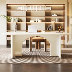 a desk with a laptop on it in front of a bookshelf