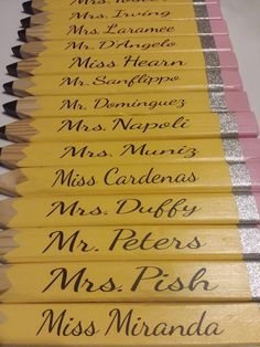 several pencils with writing on them are lined up