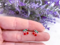 Silver red cherries stud earrings for girls, Colorful enamel small cherries post earrings for kids, 925 Sterling silver fruit stud earrings. Super colorful set of silver red cherries stud earrings perfect for summer and make feel your little one special and beautiful. Metal : 925 Sterling Silver. ( 925 stamped ) Weight : 0,45g. Measurements : 7mm x 7mm. Materials : Enamel. These delicate stud earrings are handcrafted from 925 sterling silver, that doesn't tarnish their little ears also hypoaller Toddler Earrings, Earrings Kids, Children Jewelry, Unicorn Jewelry, Enamel Stud Earrings, Candy Jewelry, Cherry Earrings, Moon Pendant Necklace, Kids Earrings