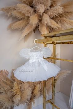 Hello! 🌟 Impressive beauty and enchantment - that's what makes our new collection of children's festive dresses so exceptional. Allow me to introduce our refined and elegant ensemble for your little princess. This children's festive dress captivates with its sophistication and detailing. The voluminous tutu made of tulle adds an air of lightness and grace to the ensemble, while the lavish sleeves crafted from organza give the attire a touch of refinement. The top and skirt of this dress are adorned with a sparkling layer of sequins, creating the effect of a true festive spark. This shimmer and proximity to a fairytale glow make your little one the unrivaled star of any celebration. Special attention is drawn to the waist, adorned with a satin bow. It not only adds elegance but also accent White Fitted Fairy Dress For Dress-up, Tulle Holiday Dress For Wedding And Party Season, Tulle Holiday Dress For Wedding Party Season, Princess Holiday Dress For Party Season, White Princess Dress For Easter, Elegant Princess Dress For Birthday And Holiday, White Tulle Easter Dress, Princess Style Birthday Holiday Dress, Princess Birthday Holiday Dress