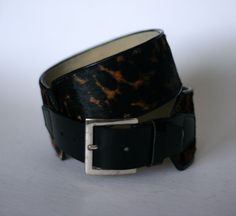 "vintage calvin klein faux leopard belt. ladies size small. faux leopard belt has a small leather belt in the front for buckling. measures 34.75\" end to end including the buckle. 2 1/8\" wide on the leopard belt. the black belt in the front is 1 5/8\" wide. silver tone buckle. good condition showing little to no use." Adjustable Belt With Buckle Closure For Fall, Leopard Belt, Vintage Calvin Klein, The Leopard, Suspender Belt, Black Belt, Suspenders, Minneapolis, Leather Belt