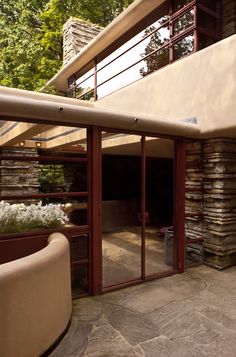 an outside view of a house with stone walls