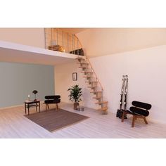 a living room filled with furniture and a stair case next to a plant on top of a hard wood floor