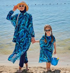 Printed Blue Swimwear For Vacation, Blue Long Sleeve Beach Dress, Blue Printed Swimwear For Beach Party, Blue Printed Swimwear For Vacation, Blue Beachwear Swim Dress For Pool, Blue Swim Dress For Spring Beach Party, Blue Swim Dress For Spring Poolside, Casual Blue Swim Dress For Summer, Blue Long Sleeve Beach Dress For Beach Party