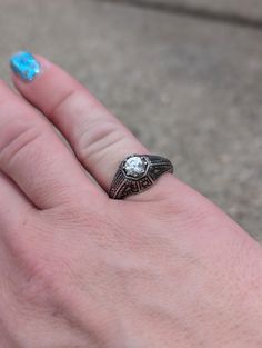 Silver Art Deco Style ring size 7. This is a repro of a vintage style Vintage Engraved Diamond Ring, Vintage Signet Ring With Center Stone For Promise, Antique Finish Anniversary Jewelry Ring, Elegant Antique Finish Wedding Rings, Elegant Formal Rings With Antique Finish, Vintage Enamel Ring With Rose Cut Diamonds As Gift, Antique Finish Rings For Anniversary, Vintage Enamel Ring With Rose Cut Diamonds For Gift, Vintage Engraved Diamond Promise Ring