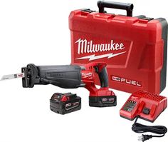 a milwaukee tool kit with tools in the box and cordless drill driver on it