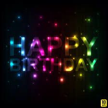 the words happy birthday are lit up in bright colors and sparkles on a black background