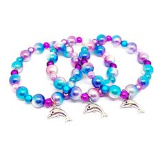 These adorable stretchy bracelets are the perfect favor for your little one's Mermaid themed party! Each bracelet features a opaque, glittery resin mermaid tail charm, resin rhinestone beads and an assortment of purple, turquoise blue, lavender and cyan 10mm acrylic beads strung with durable stretch floss cord. Each bracelet will arrive individually packaged in organza bags. Select the size and quanity needed from the drop down menus. If you would like more than one size, just leave a note durin Playful Purple Jewelry For Party, Themed Adjustable Bracelets For Parties, Whimsical Adjustable Beaded Bracelets For Party, Silver Novelty Bracelets For Party, Playful Hypoallergenic Party Jewelry, Playful Hypoallergenic Jewelry For Party, Playful Plastic Beaded Bracelets For Parties, Adjustable Themed Jewelry For Parties, Plastic Bead Jewelry For Birthday