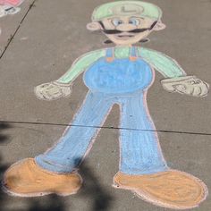 a chalk drawing of a man on the sidewalk