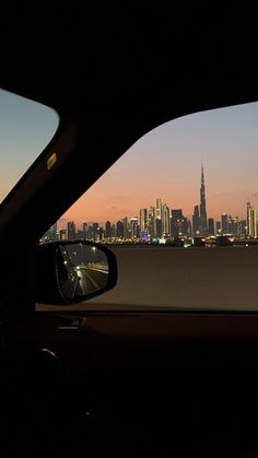 a view of the city skyline from inside a car