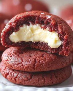 two red velvet cookies with butter on top