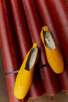 Sizing: This shoe fits true to size.Calfskin yellow leather ballerinas flats with square toe and elastic closure.Logo-embossed leather pull-loop at heel collar featuring brands logo. Cushioned Yellow Flat Loafers For Spring, Yellow Leather Loafers For Work, Yellow Flat Heel Loafers For Fall, Yellow Leather Loafers With Almond Toe, Yellow Loafers For Fall, Fall Yellow Loafers With Flat Heel, Yellow Leather Loafers For Fall, Yellow Flats With Flat Heel For Fall, Yellow Flats For Fall